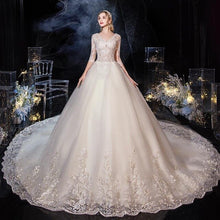 Load image into Gallery viewer, EZKUNTZA 2020 New Sexy V Illusion Neck Half Sleeve Wdding Dress Luxury Lace Embroidery Plus Size Lace Up Princess Ball Gown
